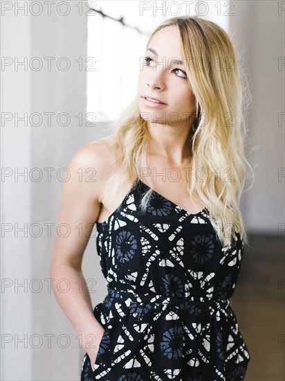 Portrait of young blond woman contemplating