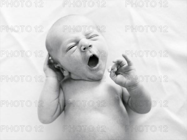 Portrait of newborn boy ( 0-1 months ) yawning