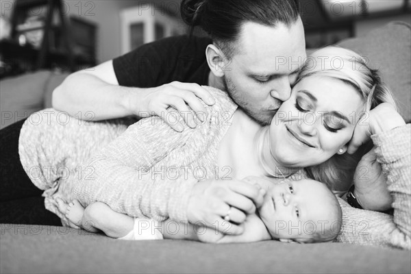 Portrait of parents with newborn boy ( 0-1 months )