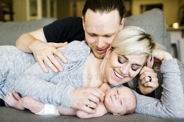 Portrait of parents with newborn boy ( 0-1 months )