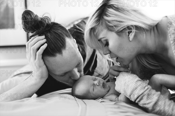 Portrait of parents with newborn boy ( 0-1 months )