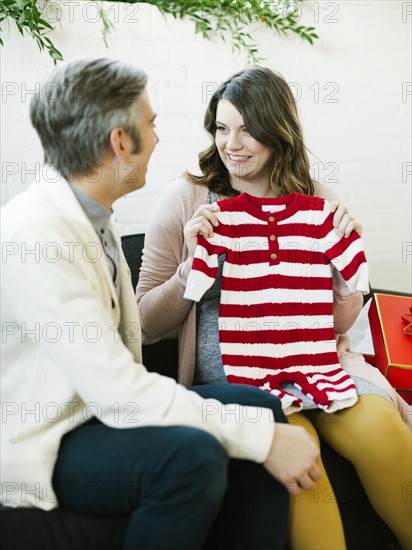 Pregnant woman receiving  christmas present