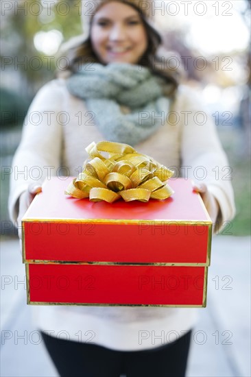 Woman holding Christmas gift