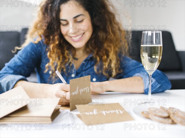 Woman handwriting in living room