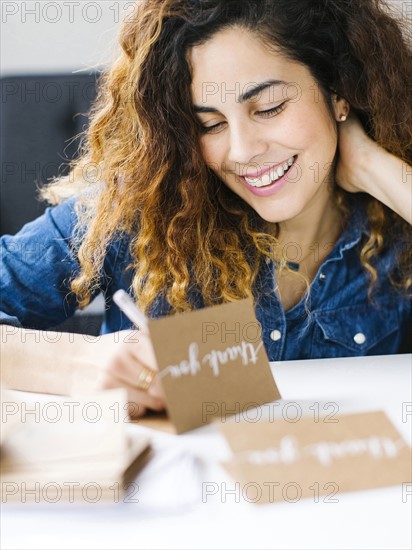 Woman handwriting in living room