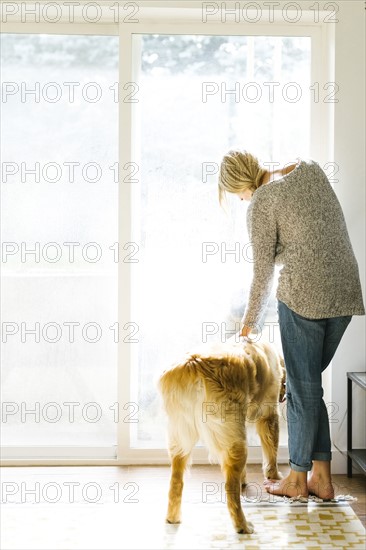 Woman at home with dog