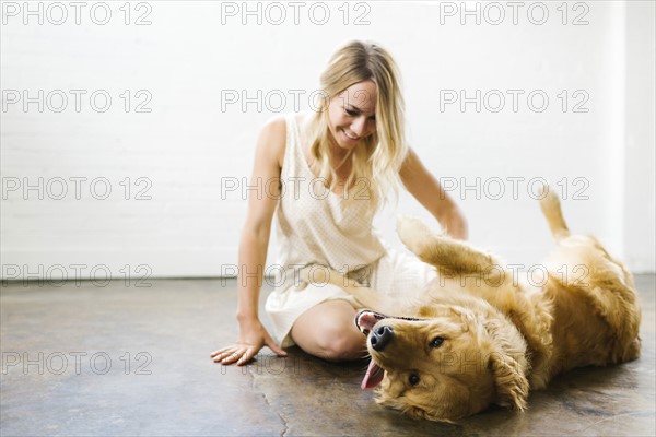 Woman stroking dog