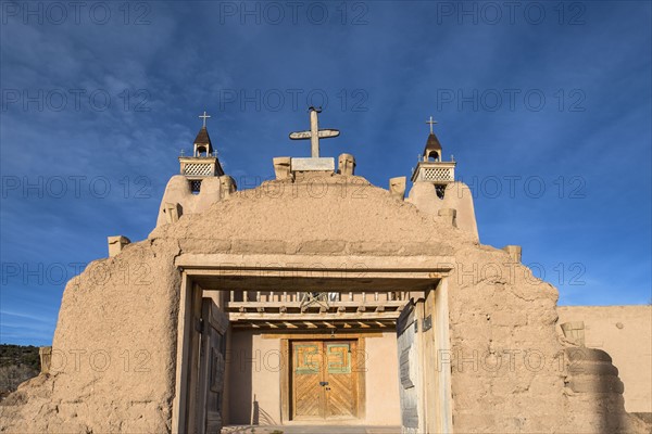 USA, New Mexico, Las Trampas, Facade of San Jose de Gracia church seen through gate