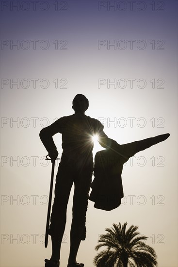 Spain, Seville, Silhouette of statue of bullfighter Pepe Luis Vasquez in Plaza de Toros