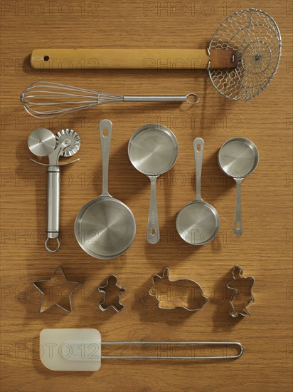 Studio shot of kitchen utensils on wooden table