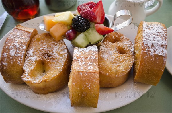 Plate with fresh french toasts and fruits