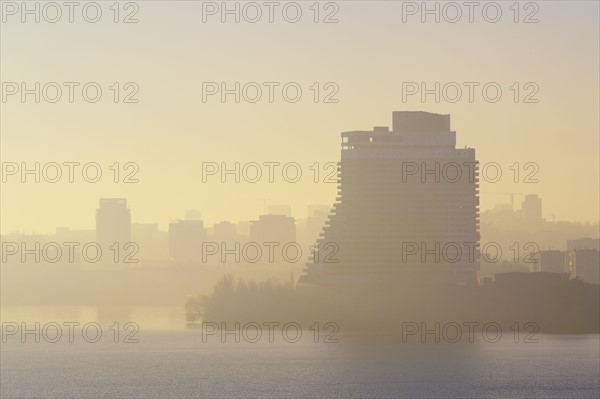 Ukraine, Dnepropetrovsk, City skyline at foggy dawn