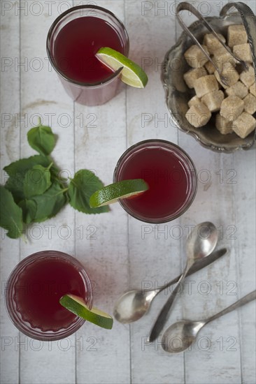 Overhead view of fresh tea with lime and mint