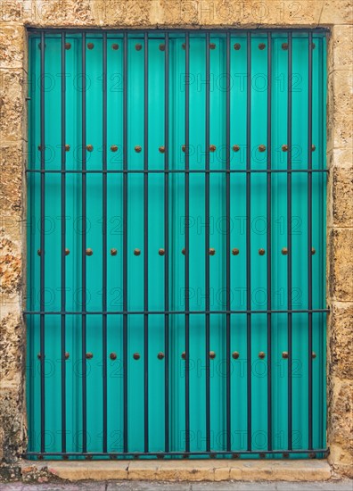 Cuba, Havana, Building exterior with turquoise shutters