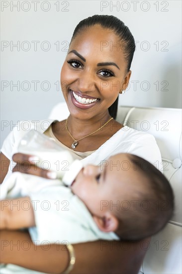 Portrait of mother feeding baby boy (2-5 months)