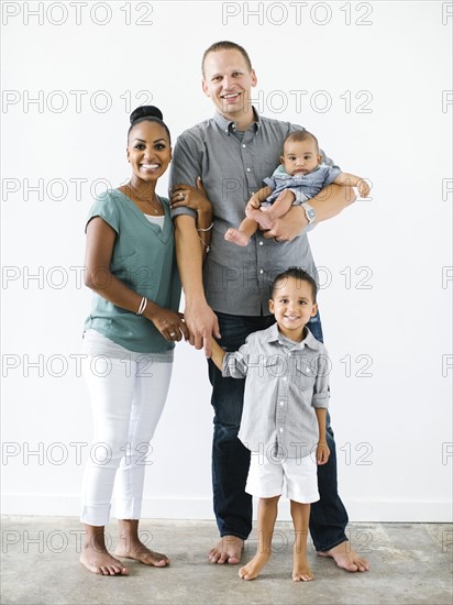 Portrait of family with two children (2-5 months, 2-3)