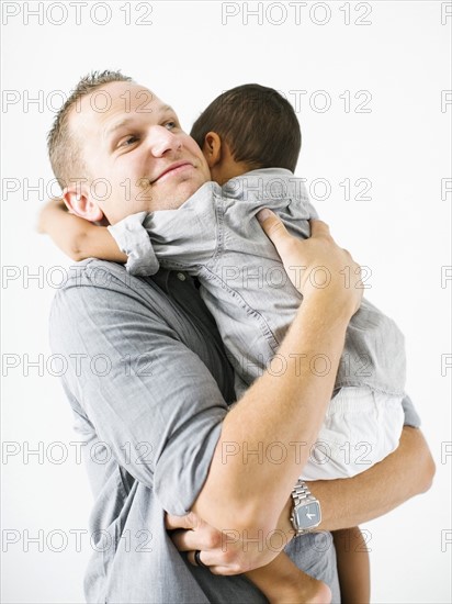 Father holding son (2-3)