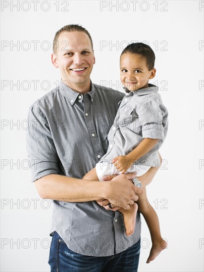 Father holding son (2-3)