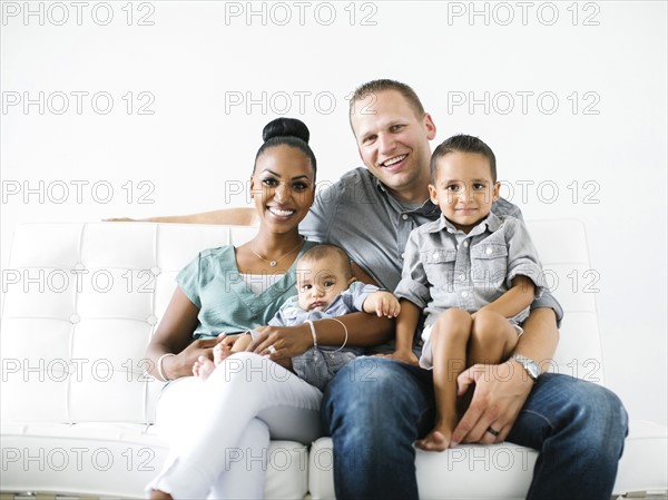 Portrait of family with two children (2-5 months, 2-3)