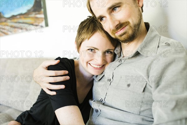 Couple sitting on sofa