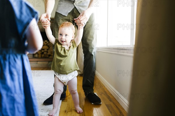 Father walking with daughter (12-17 months)