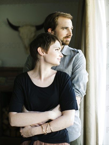 Couple looking through window