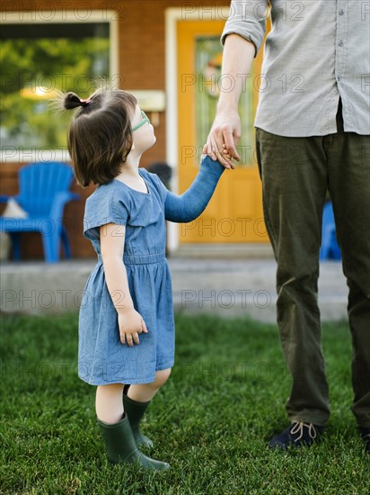 Daughter (2-3) looking at father