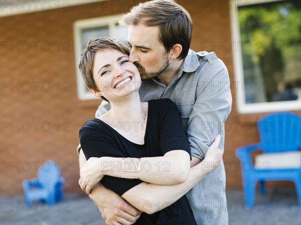 Happy couple kissing and embracing