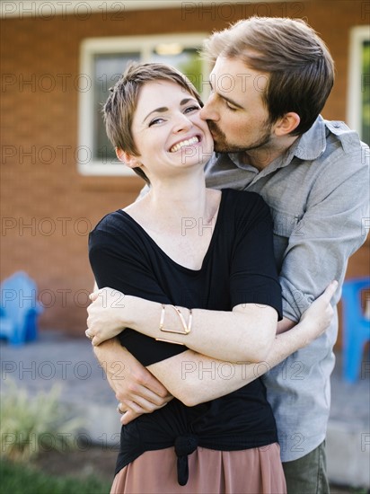 Happy couple kissing and embracing