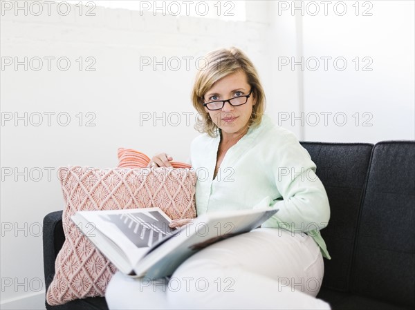 Portrait of Mature woman reading book
