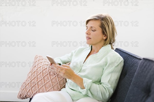 Mature woman using phone