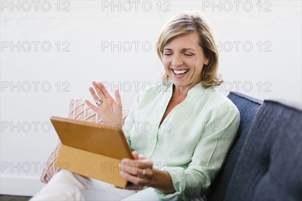 Mature woman using tablet