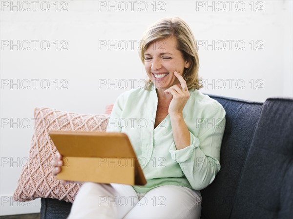 Mature woman using tablet