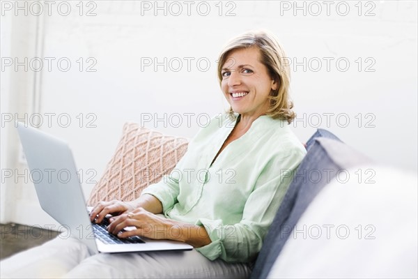 Portrait of Mature woman using computer