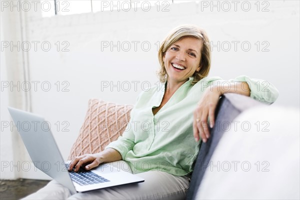Portrait of Mature woman using computer