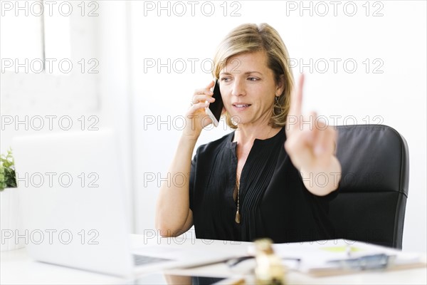 Mature woman talking on mobile phone