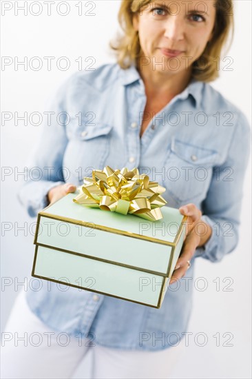 Portrait of Mature woman holding gift