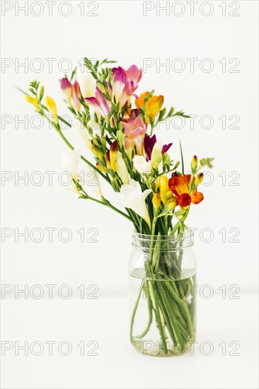 Jar with bunch of flowers