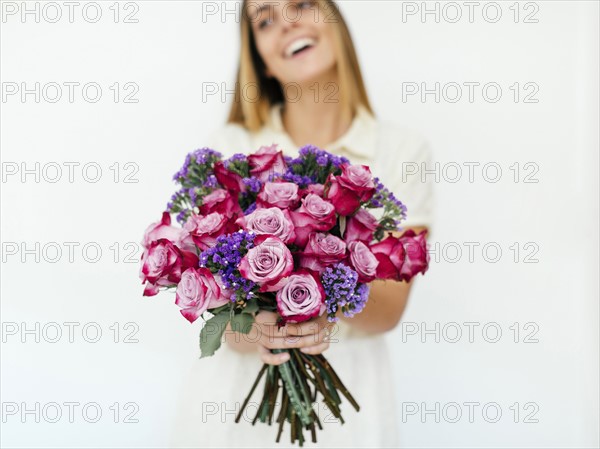 Woman holding bouquet of roses