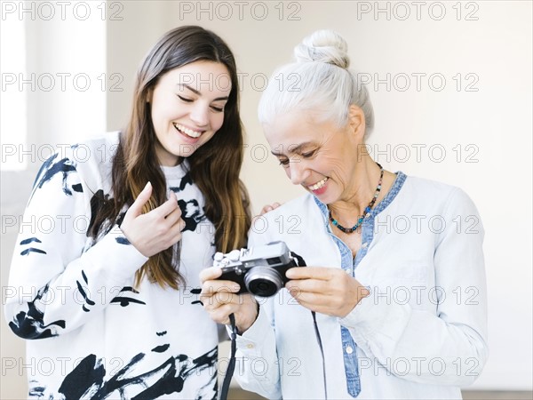 Daughter and mother preparing to make photographs
