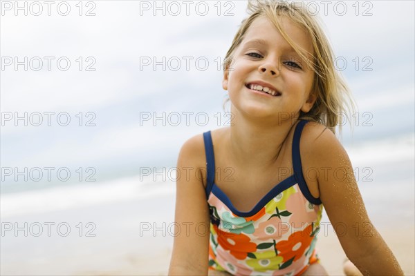 Portrait of girl (6-7) wearing swimming costume