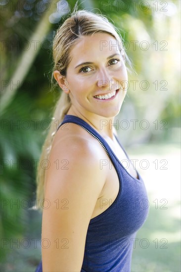 Blonde woman in tank top smiling