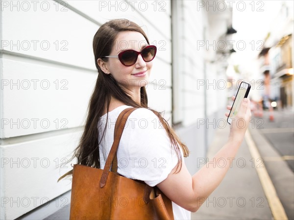 San Juan, Puerto Rico, Beautiful woman walking city streets