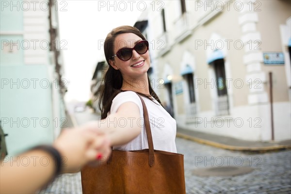 San Juan, Puerto Rico, Beautiful woman walking city streets