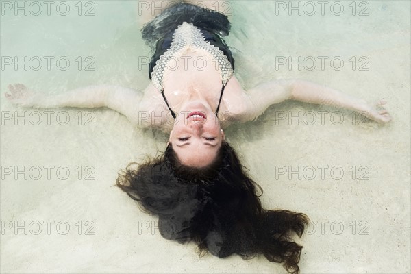 Woman floating on water