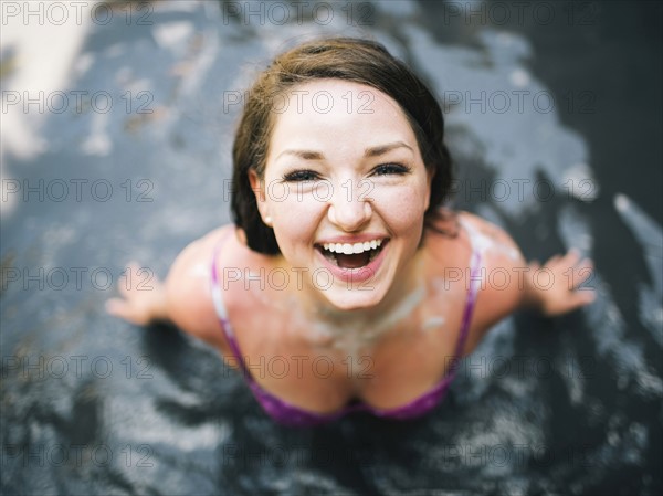 Woman bathing in mud