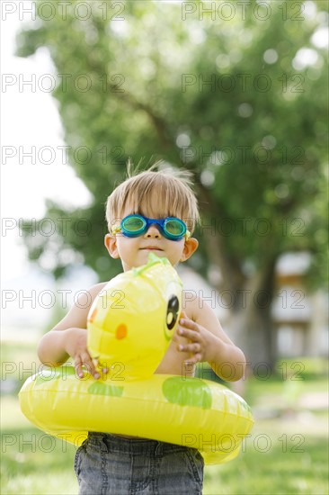 Boy(2-3) with inflatable ring-turtle