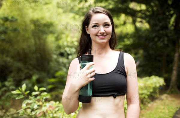 Caribbean Islands, Saint Lucia, woman with bottle of water