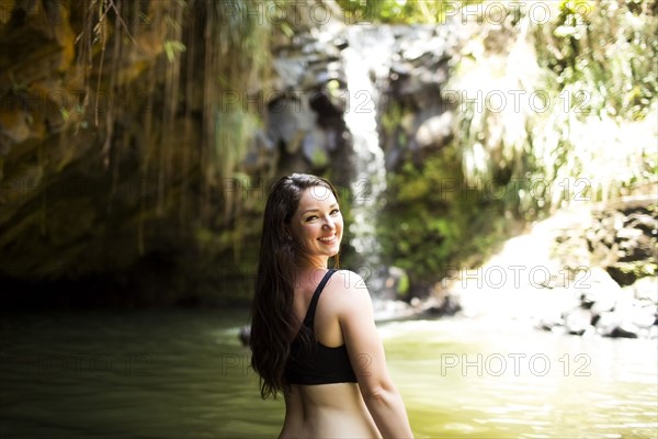 Caribbean Islands, Saint Lucia, Woman by waterfall
