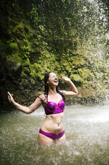 Caribbean, Saint Lucia, Woman wading in pond